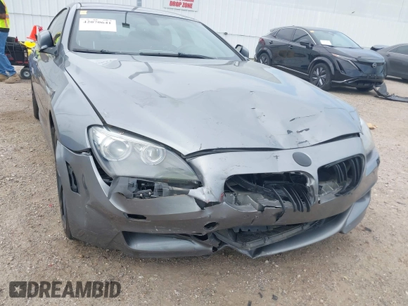2014 BMW 6 Series 650i z VIN WBA6B2C55ED128934, wystawiony jako IAAI lot #42070641 z przebiegiem 102 597 mil mil oraz . Historia ofert i sprzedaży dostępna na DreamBid. Obrazek 6.