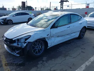 2023 Tesla Model 3 with VIN 5YJ3E1EA6PF495631, listed as a IAAI auction lot 41568118 with 10,073 mi miles and . Bid and sale history available at DreamBid. Image 2.