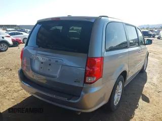 2015 Dodge Grand Caravan SXT with VIN 2C4RDGCG1FR649074, listed as a IAAI auction lot 41759409 with 116,856 mi miles and . Bid and sale history available at DreamBid. Image 4.