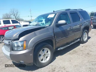 2013 Chevrolet Tahoe LT with VIN 1GNSKBE09DR325729, listed as a IAAI auction lot 41989587 with 186,361 mi miles and . Bid and sale history available at DreamBid. Image 2.