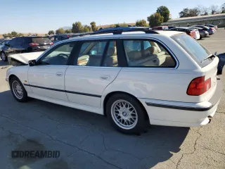 1999 BMW 5 Series 528iAt with VIN WBADP6330XBV61784, listed as a Copart auction lot 77685734 with 210,383 mi miles and Salvage Title. Bid and sale history available at carsss.com. Image 2.