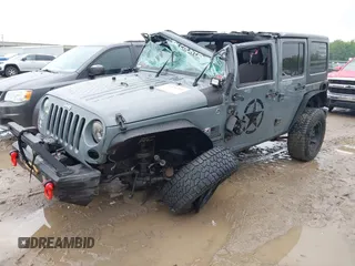 2014 Jeep Wrangler Unlimited Sport with VIN 1C4BJWDG1EL135073, listed as a IAAI auction lot 42435361 with 129,144 mi miles and . Bid and sale history available at DreamBid. Image 2.