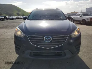 2016 Mazda CX-5 Sport with VIN JM3KE2BY0G0730906, listed as a Copart auction lot 51611865 with 207,166 mi miles and Salvage Title. Bid and sale history available at carsss.com. Image 5.