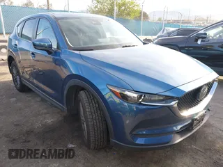 2021 Mazda CX-5 Touring with VIN JM3KFACM5M0332718, listed as a IAAI auction lot 41905933 with 30,930 mi miles. Bid and sale history available at carsss.com. Image 1.