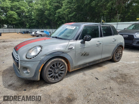2015 MINI Hardtop 4 Door with VIN WMWXS5C5XFT831555, listed as a Copart auction lot 61673485 with 104,120 mi miles and Salvage title. Bid and sale history available at DreamBid. Image 1.