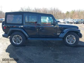 2018 Jeep Wrangler Unlimited Sahara with VIN 1C4HJXEG9JW263178, listed as a IAAI auction lot 41877138 with 82,723 mi miles. Bid and sale history available at carsss.com. Image 13.