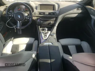 2015 BMW M6 z VIN WBS6C9C52FD467461, wystawiony jako Copart lot #68057084 z przebiegiem 130 687 mil mil oraz Szkoda całkowita • Salvage title. Historia ofert i sprzedaży dostępna na DreamBid. Obrazek 8.