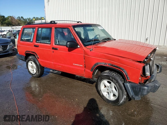 1999 Jeep Cherokee SE with VIN 1J4FT28S6XL515896, listed as a Copart auction lot 83745444 with 192,406 mi miles and Salvage title. Bid and sale history available at DreamBid. Image 4.