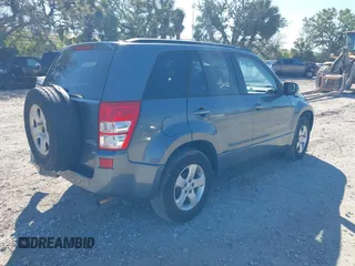 2006 Suzuki Grand Vitara Premium z VIN JS3TD943064100693, wystawiony jako IAAI lot #41772479 z przebiegiem 135 901 mil mil oraz . Historia ofert i sprzedaży dostępna na DreamBid. Obrazek 4.