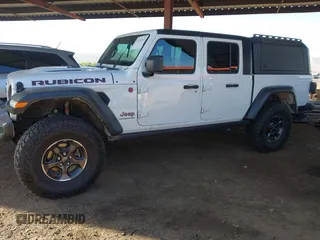 2022 Jeep Gladiator Rubicon with VIN 1C6JJTBM6NL145009, listed as a IAAI auction lot 42134143 with 59,438 mi miles and . Bid and sale history available at DreamBid. Image 17.