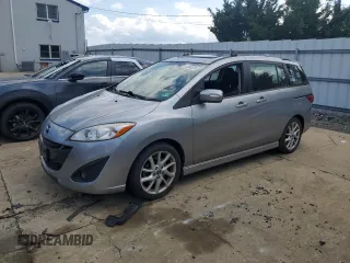 2014 Mazda 5 Touring с VIN JM1CW2CL0E0165079, выставлен на аукционе Copart как лот 64843325 с пробегом 76 153 миль миль и Списание • Salvage title. История ставок и продаж доступна на DreamBid. Изображение 1.