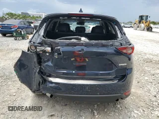 2021 Mazda CX-5 Grand Touring z VIN JM3KFBDM5M0464611, wystawiony jako Copart lot #62829065 z przebiegiem 20 525 mil mil oraz Nie do naprawy • Non repairable. Historia ofert i sprzedaży dostępna na DreamBid. Obrazek 6.
