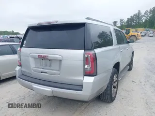 2015 GMC Yukon XL SLT with VIN 1GKS1HKC2FR251672, listed as a IAAI auction lot 42152312 with 232,736 mi miles and . Bid and sale history available at carsss.com. Image 4.