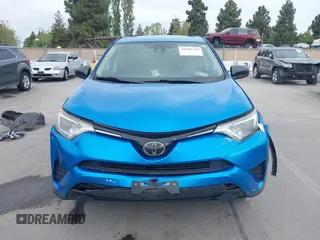 2018 Toyota RAV4 LE with VIN 2T3BFREV6JW740214, listed as a IAAI auction lot 42106349 with 105,831 mi miles and . Bid and sale history available at carsss.com. Image 13.