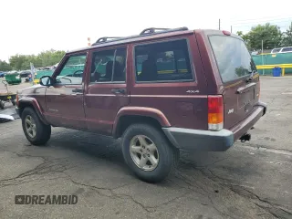2000 Jeep Cherokee with VIN 1J4FF48SXYL198290, listed as a Copart auction lot 66026705 with 201,409 mi miles and Clean title. Bid and sale history available at DreamBid. Image 2.