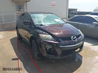 2010 Mazda CX-7 SV with VIN JM3ER2W50A0348738, listed as a IAAI auction lot 41703807 with 238,680 mi miles. Bid and sale history available at carsss.com. Image 1.