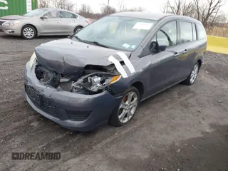 2010 Mazda 5 Sport with VIN JM1CR2WLXA0370650, listed as a IAAI auction lot 41602072 with 142,611 mi miles and . Bid and sale history available at DreamBid. Image 2.