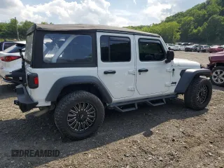 2023 Jeep Wrangler Sport with VIN 1C4HJXDGXPW596127, listed as a Copart auction lot 65395655 with 64,257 mi miles and Salvage title. Bid and sale history available at DreamBid. Image 3.