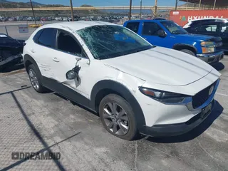 2021 Mazda CX-30 Select z VIN 3MVDMABL9MM309437, wystawiony jako IAAI lot #42245234 z przebiegiem 50 348 mil mil oraz . Historia ofert i sprzedaży dostępna na DreamBid. Obrazek 1.