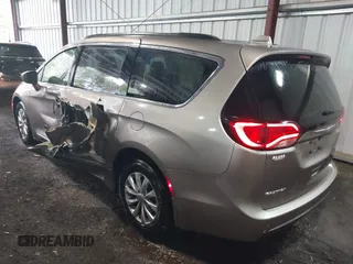 2017 Chrysler Pacifica Touring L with VIN 2C4RC1BG5HR565540, listed as a IAAI auction lot 41999464 with 110,056 mi miles and . Bid and sale history available at DreamBid. Image 3.