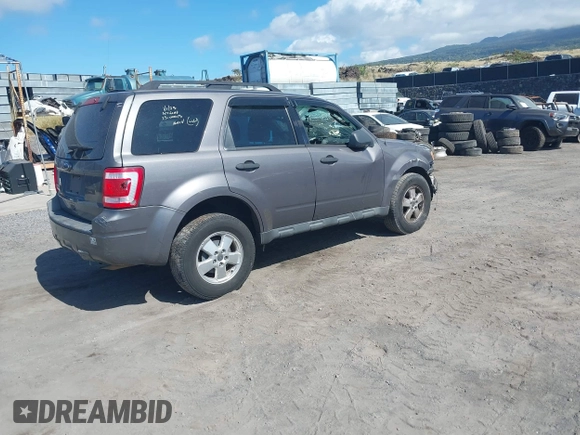 2011 Ford Escape XLT with VIN 1FMCU0D79BKB79697, listed as a IAAI auction lot 41265677 with 138,026 mi miles. Bid and sale history available at carsss.com. Image 4.