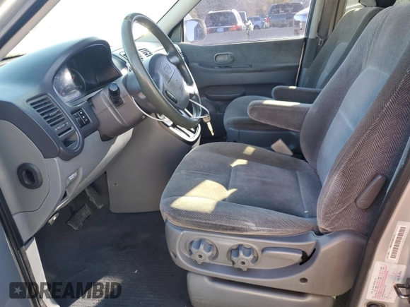 2003 Kia Sedona LX with VIN KNDUP131236371153, listed as a Copart auction lot 80989974 with 205,181 mi miles and Salvage Title. Bid and sale history available at carsss.com. Image 7.