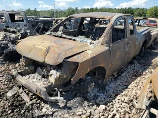2010 Nissan Titan SE with VIN 1N6BA0CH0AN325143, listed as a Copart auction lot 66860214 with 77,033 mi miles and Salvage Title. Bid and sale history available at carsss.com. Image 1.