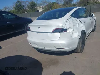 2022 Tesla Model 3 with VIN 5YJ3E1EA2NF245817, listed as a IAAI auction lot 41976493 with 32,710 mi miles and . Bid and sale history available at DreamBid. Image 6.
