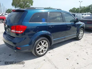 2014 Dodge Journey SXT with VIN 3C4PDCBG3ET218328, listed as a IAAI auction lot 42086656 with 55,620 mi miles. Bid and sale history available at carsss.com. Image 4.
