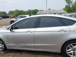 2016 Ford Fusion SE with VIN 3FA6P0H76GR338557, listed as a IAAI auction lot 42424262 with 165,299 mi miles and . Bid and sale history available at DreamBid. Image 14.
