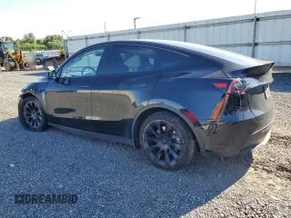 2023 Tesla Model Y Long Range z VIN 7SAYGDEE1PF865195, wystawiony jako Copart lot #57455765 z przebiegiem 32 011 mil mil oraz Szkoda całkowita • Salvage title. Historia ofert i sprzedaży dostępna na DreamBid. Obrazek 2.