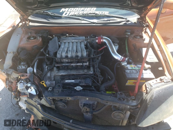 2006 Hyundai Tiburon GT z VIN KMHHN65F66U191134, wystawiony jako Copart lot #56692615 z przebiegiem 197 093 mil mil oraz Szkoda całkowita • Salvage title. Historia ofert i sprzedaży dostępna na DreamBid. Obrazek 11.