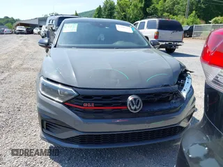2021 Volkswagen Jetta GLI S z VIN 3VW6T7BU9MM052902, wystawiony jako IAAI lot #42286711 z przebiegiem 91 519 mil mil oraz . Historia ofert i sprzedaży dostępna na DreamBid. Obrazek 13.
