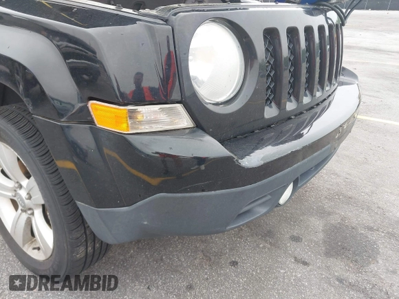 2014 Jeep Patriot Latitude with VIN 1C4NJRFB7ED713462, listed as a IAAI auction lot 42036671 with 116,276 mi miles. Bid and sale history available at carsss.com. Image 6.