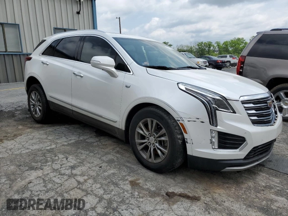 2020 Cadillac XT5 Premium Luxury FWD with VIN 1GYKNCRS5LZ229686, listed as a Copart auction lot 57391915 with 54,491 mi miles and Salvage title. Bid and sale history available at DreamBid. Image 4.