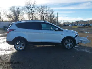 2017 Ford Escape Titanium with VIN 1FMCU9J98HUA04994, listed as a IAAI auction lot 41139988 with 136,989 mi miles. Bid and sale history available at carsss.com. Image 13.