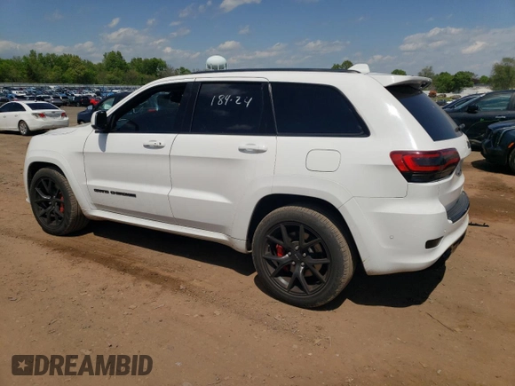 2018 Jeep Grand Cherokee with VIN NJ1449E, listed as a Copart auction lot 51357834 with 32,619 mi miles and Salvage title. Bid and sale history available at DreamBid. Image 2.