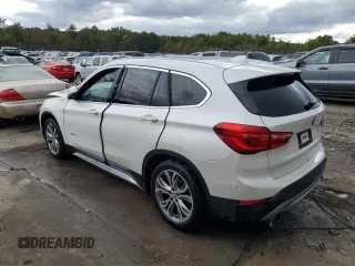 2017 BMW X1 xDrive28i z VIN WBXHT3C35H5F68041, wystawiony jako Copart lot #74858123 z przebiegiem 103 234 mil mil oraz Szkody całkowita. Historia ofert i sprzedaży dostępna na DreamBid. Obrazek 2.