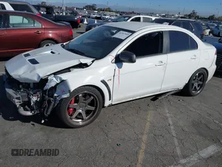 2012 Mitsubishi Lancer Evolution MR with VIN JA32W5FV3CU009679, listed as a IAAI auction lot 40787549 with 167,206 mi miles. Bid and sale history available at carsss.com. Image 2.