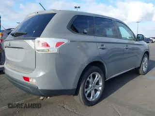 2014 Mitsubishi Outlander SE z VIN JA4AD3A37EZ011335, wystawiony jako IAAI lot #42115343 z przebiegiem 129 159 mil mil oraz . Historia ofert i sprzedaży dostępna na DreamBid. Obrazek 4.