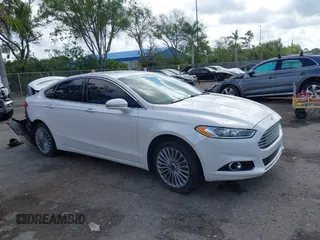 2016 Ford Fusion Titanium with VIN 3FA6P0K96GR400436, listed as a IAAI auction lot 42191256 with 128,447 mi miles and . Bid and sale history available at DreamBid. Image 1.