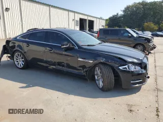 2015 Jaguar XJ with VIN SAJWA1CZ7F8V83167, listed as a Copart auction lot 74991144 with 94,502 mi miles and Salvage Title. Bid and sale history available at carsss.com. Image 4.