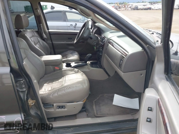2004 Jeep Grand Cherokee Limited with VIN 1J4GW58N54C372118, listed as a IAAI auction lot 42526424 with 187,430 mi miles and . Bid and sale history available at DreamBid. Image 5.