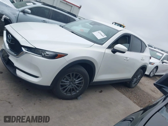 2017 Mazda CX-5 Touring z VIN JM3KFBCL5H0128584, wystawiony jako IAAI lot #42354669 z przebiegiem 56 563 mil mil oraz . Historia ofert i sprzedaży dostępna na DreamBid. Obrazek 14.