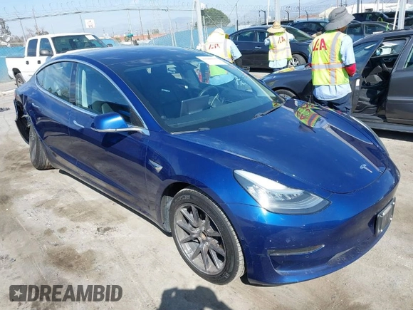 2018 Tesla Model 3 Long Range Battery z VIN 5YJ3E1EA4JF078080, wystawiony jako IAAI lot #41688015 z przebiegiem 97 886 mil mil oraz . Historia ofert i sprzedaży dostępna na DreamBid. Obrazek 1.