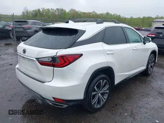 2021 Lexus RX with VIN 2T2HZMDA3MC266624, listed as a IAAI auction lot 42011029 with 27,401 mi miles. Bid and sale history available at carsss.com. Image 4.
