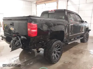2015 Chevrolet Silverado 1500 High Country with VIN 3GCUKTEJXFG320011, listed as a IAAI auction lot 41366273 with 157,947 mi miles. Bid and sale history available at carsss.com. Image 4.