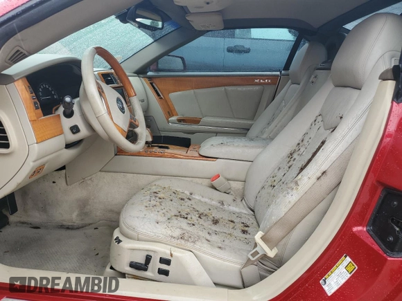2005 Cadillac XLR z VIN 1G6YV34AX55600837, wystawiony jako Copart lot #75055604 z przebiegiem Nie podano mil oraz Szkoda całkowita • Salvage title. Historia ofert i sprzedaży dostępna na DreamBid. Obrazek 7.