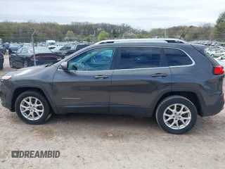 2015 Jeep Cherokee Latitude with VIN 1C4PJLCS9FW542181, listed as a IAAI auction lot 42183167 with 144,607 mi miles and . Bid and sale history available at carsss.com. Image 14.