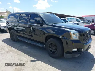 2015 GMC Yukon XL SLT z VIN 1GKS1HKC1FR620070, wystawiony jako IAAI lot #42200458 z przebiegiem 147 580 mil mil oraz . Historia ofert i sprzedaży dostępna na DreamBid. Obrazek 1.
